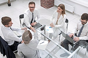 Top view.handshake business partners at the negotiating table.