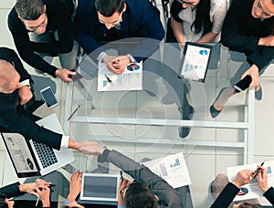 Top view. handshake of business people at a work meeting