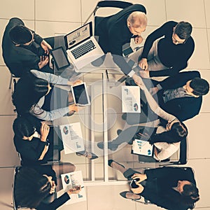 Top view. handshake of financial partners at a working meeting.