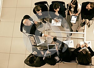 Top view. handshake of financial partners at a working meeting.