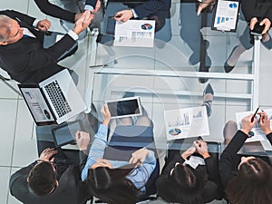 top view. handshake of financial partners at a working meeting.