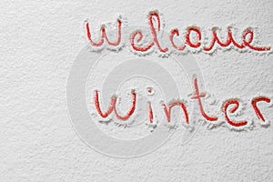 Written text `Welcome winter` on the snow