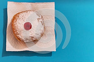 Top view of a Hanukkah mocks sufganiyah doughnut - traditional Jewish symbols of sweet doughnut photo