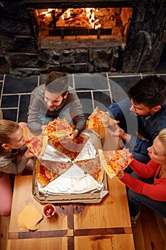 Top view of happy family eating pizza