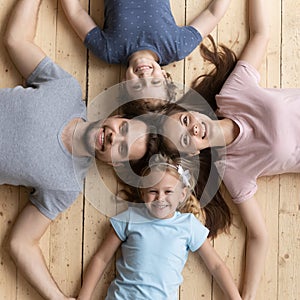 Top view of happy family hold hands showing unity