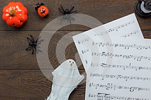 Top view of Happy Halloween Festival and music note sheet background concept.