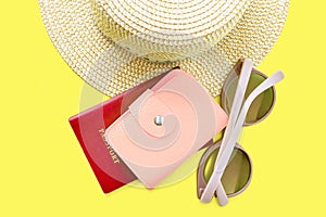 Top view of hat, sunglasses and pasport with pink leather purse. Summer vacation background. Summertime, travel, beach, tourism photo