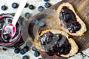 Top view of healthy breakfast with blueberry jam