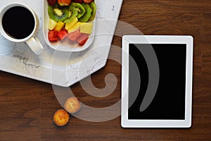 Top view of healthy breakfast and tablet with copyspace