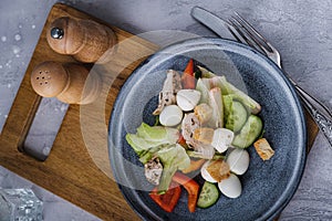 Top view healthy salad on wooden cutting board