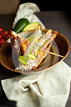 Top view of Healthy Sandwich toast with lettuce, ham, cheese and tomato on a wooden background