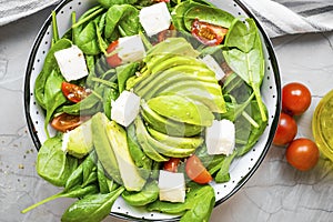 Top view of healthy vegetables and cheese salad, mediterran diet healthy eating concept, closeup of organic healthy vegetables