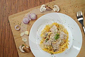 Top view of hidden spaghetti carbonara lunch dinner meal