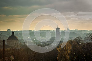 Top view from hight castle on city hall, main cathedral, and houses roofs of old Lviv