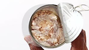 top view of holding a canned tuna