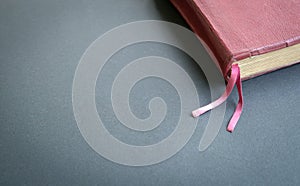 Top view Holy Bible with brown color cover on the black color table