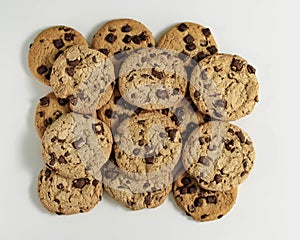 Top view of home made chocolate Chips aligned on a white background