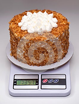 Top view Homemade cake on a kitchen scale