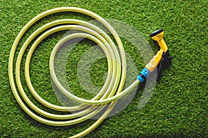 top view of hosepipe on grass, minimalistic conception