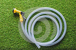 top view of hosepipe on green grass,