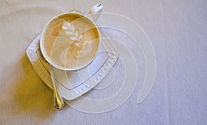 Top view of hot cappuccino coffee or latte with fine foam and milk in the coffee shop