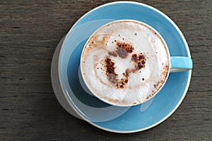 Top view of hot cocoa latte with heart shaped frothed milk in ce