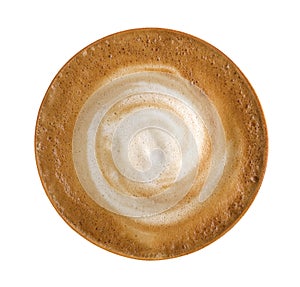 Top view of hot coffee cappuccino spiral foam isolated on white