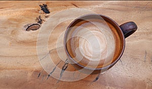 Top view of hot coffee cappuccino on wood table background