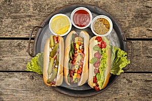 top view hot dogs with sauce plate. High quality photo