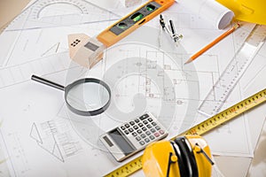 Top view of house plan blueprint paper with repair tools on table desk at architecture office