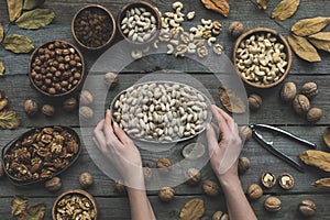 Assorted nuts and autumn leaves