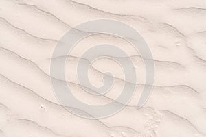 Top view of idyllic sandy dunes ridges ripples beach. Summer, holiday, vacation, travelling, tourism, landscape, desert.