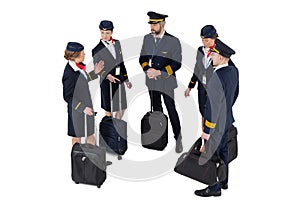 Top view of an aircrew with travel bags standing and talking photo