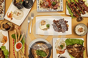 top view image of asian food dishes, tagalog, spring rolls, roast beef photo