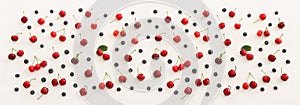Top view image of colorful assorted mix of berries, blueberry and sweet cherry over wooden white background