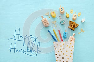 Top view image of jewish holiday Hanukkah background with traditional spinnig top, menorah