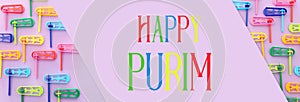 Top view image of Purim celebration concept jewish carnival holiday over purple background. Top view, flat lay