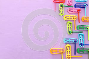 Top view image of Purim celebration concept jewish carnival holiday over purple background. Top view, flat lay