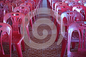 Top view image, red plastic chairs arranged in the meeting room