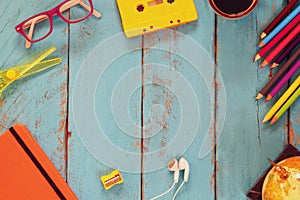 Top view image of school supplies on wooden table. vintage filtered. education concept