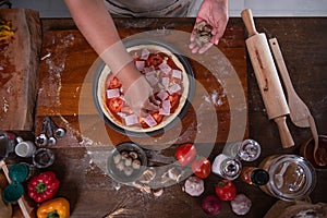 Top view images, a people preparing equipment and ingredients, flour, vegetables for making pizza