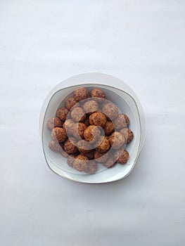 Top view of indonesian snack ball choco on the bowl,  white background