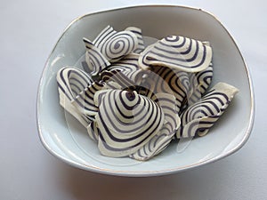 Top view of indonesian snack called KUPING GAJAH on the bowl,  white background