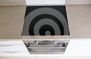 Top view of induction cooker hob on kitchen worktop