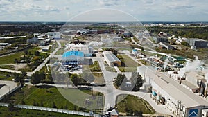 Top view of industrial area located in suburbs. Stock footage. Operating industrial enterprises in suburban area of town