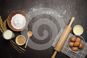 Top view of ingredients bakery making on black wooden table