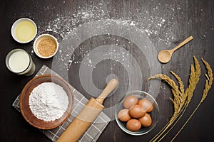 Top view of ingredients bakery making on black wooden table