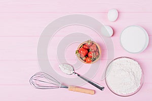 Top view of ingredients for baking strawberry cake