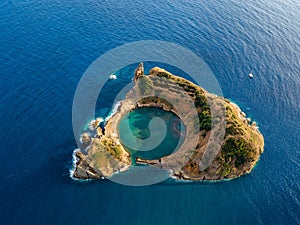 Top view of Islet of Vila Franca do Campo is formed by the crater of an old underwater volcano near San Miguel island, Azores, Por photo