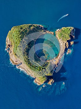 Top view of Islet of Vila Franca do Campo is formed by the crater of an old underwater volcano near San Miguel island, Azores, Por